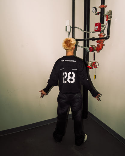 reward + risk cropped varsity jersey